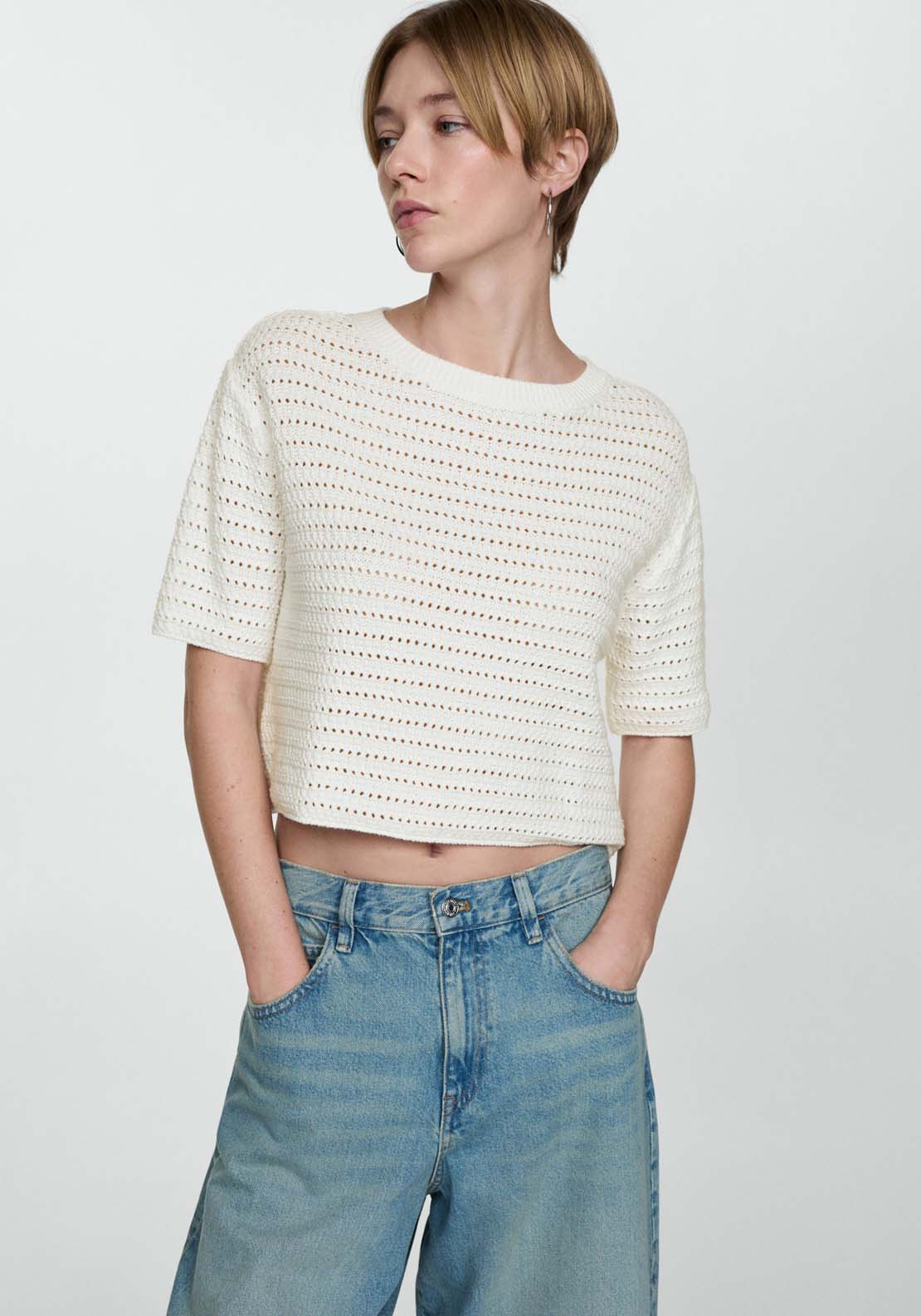 Knitted sweater with openwork details